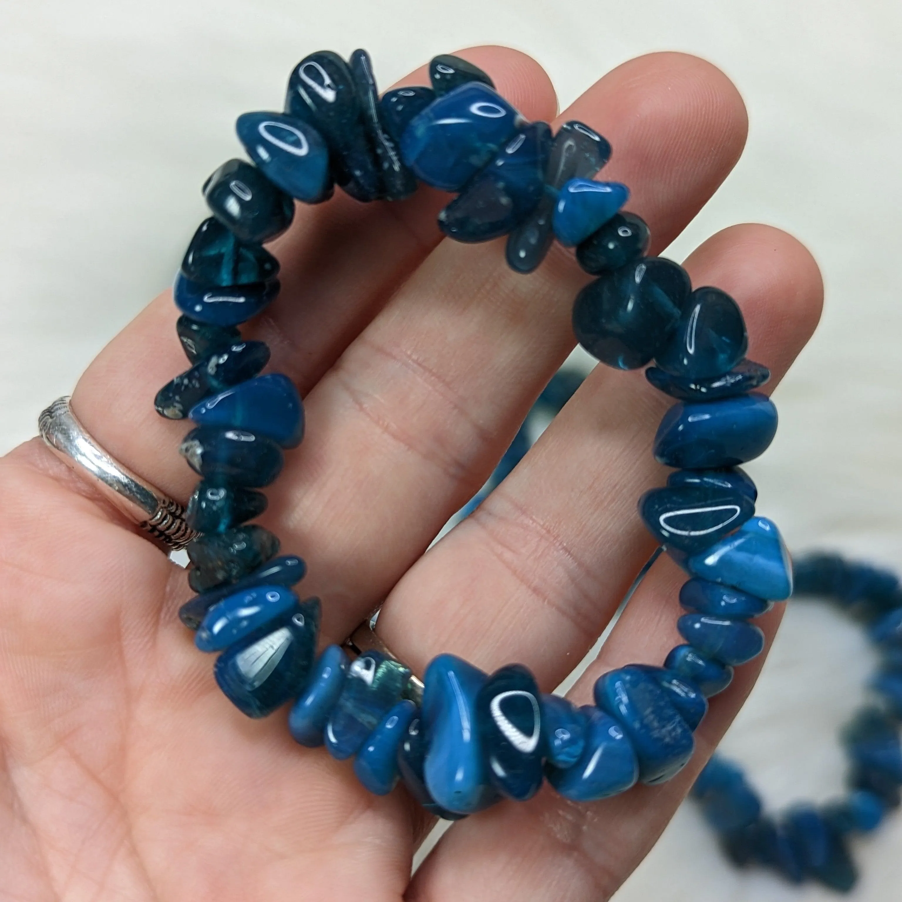 One Blue Glossy Glass Chip Bracelet on Stretchy Cord